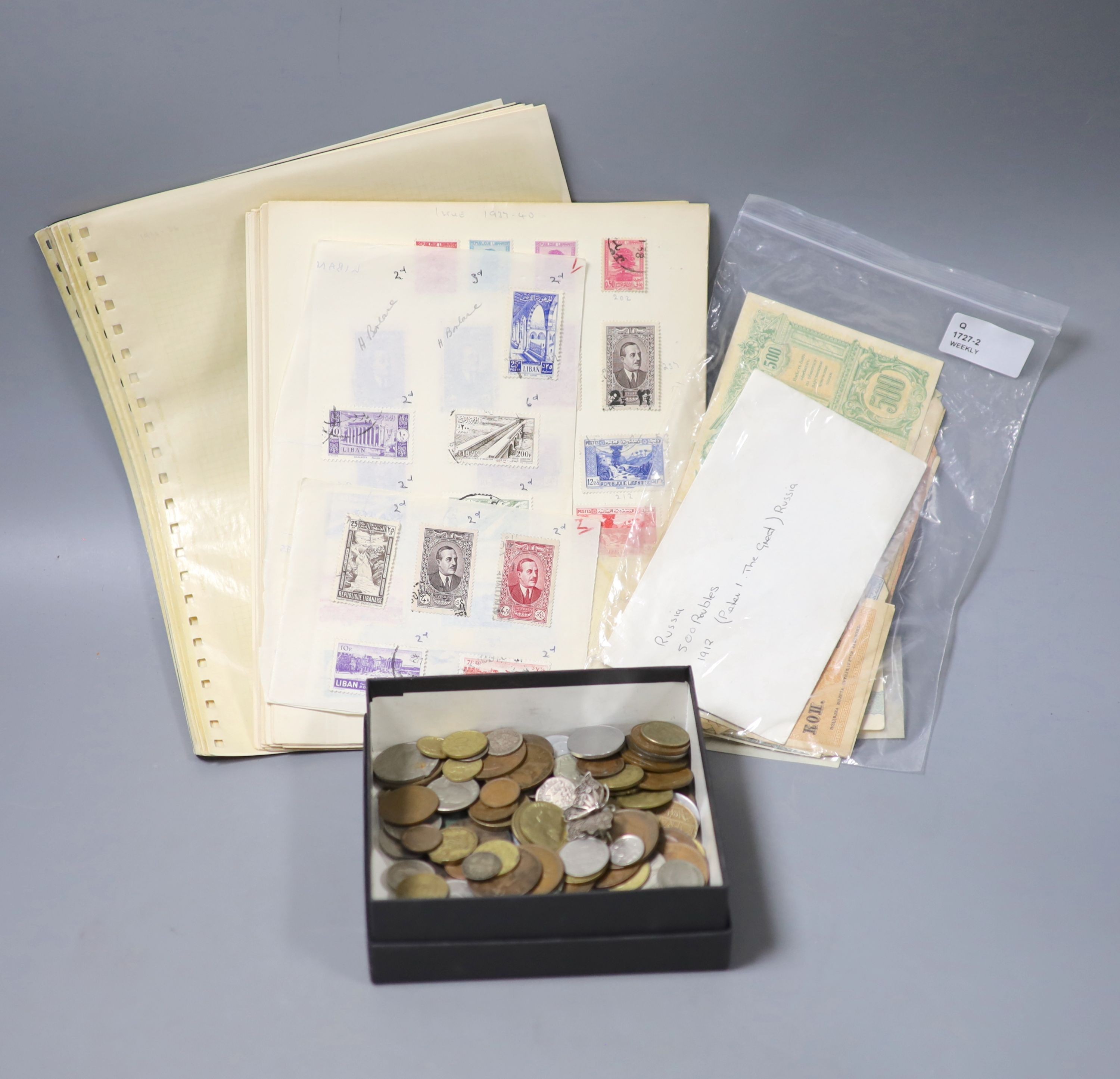 A collection of miscellaneous coins, stamps and banknotes